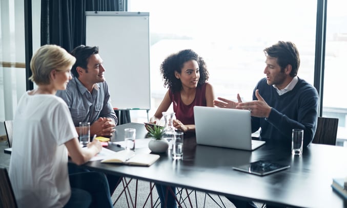 Shot-of-a-group-of-coworkers-in-a-boardroom_websize