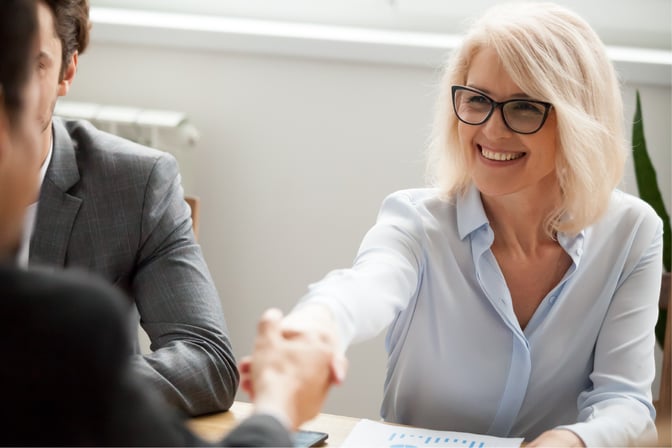 bigstock-Smiling-Attractive-Mature-Business-Woman-shaking-hands_web-size-1