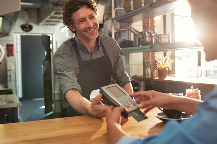 Woman-paying-by-credit-card