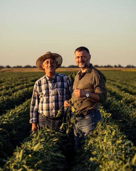 resized-for-close-up_vertical_father-and-son-on-a-farm-in-a-paddock_farming_iStock-1440206193