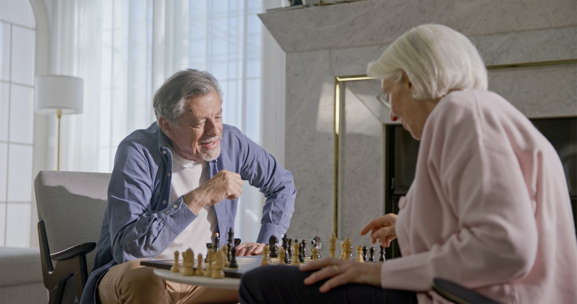 Senior Couple Engaged in Chess Game_iStock-2201682320