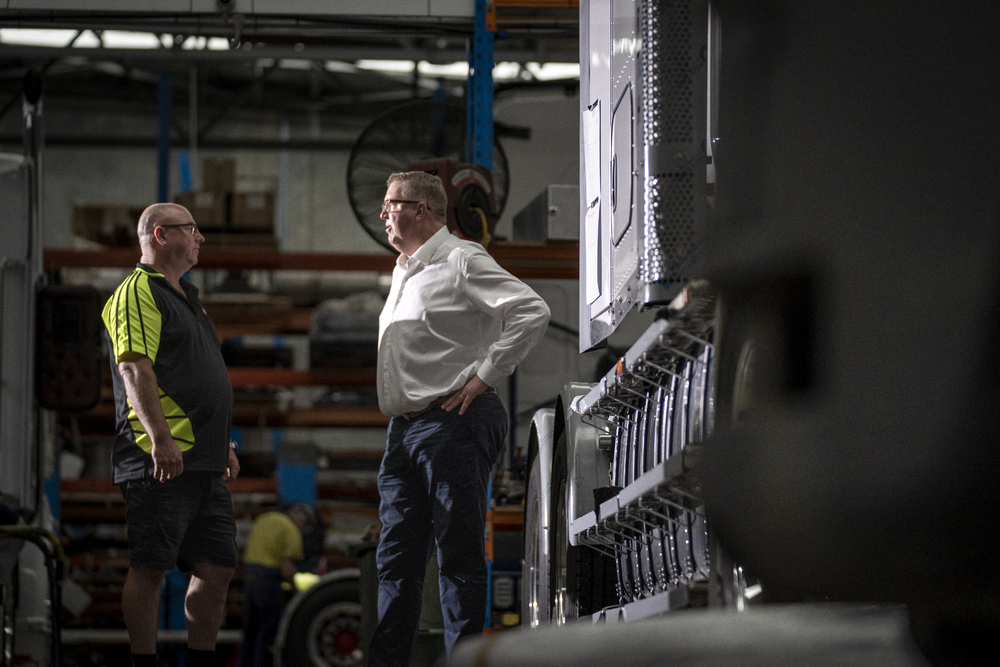 Ulton Mark McLean talking with client in shed