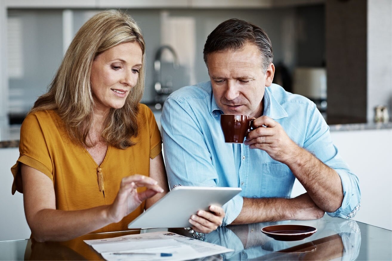 couple-sitting-at-kitchen-table