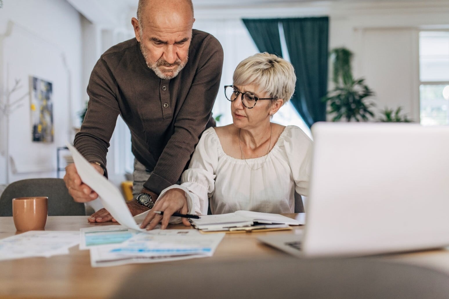 older-couple-looking-at-paperwor
