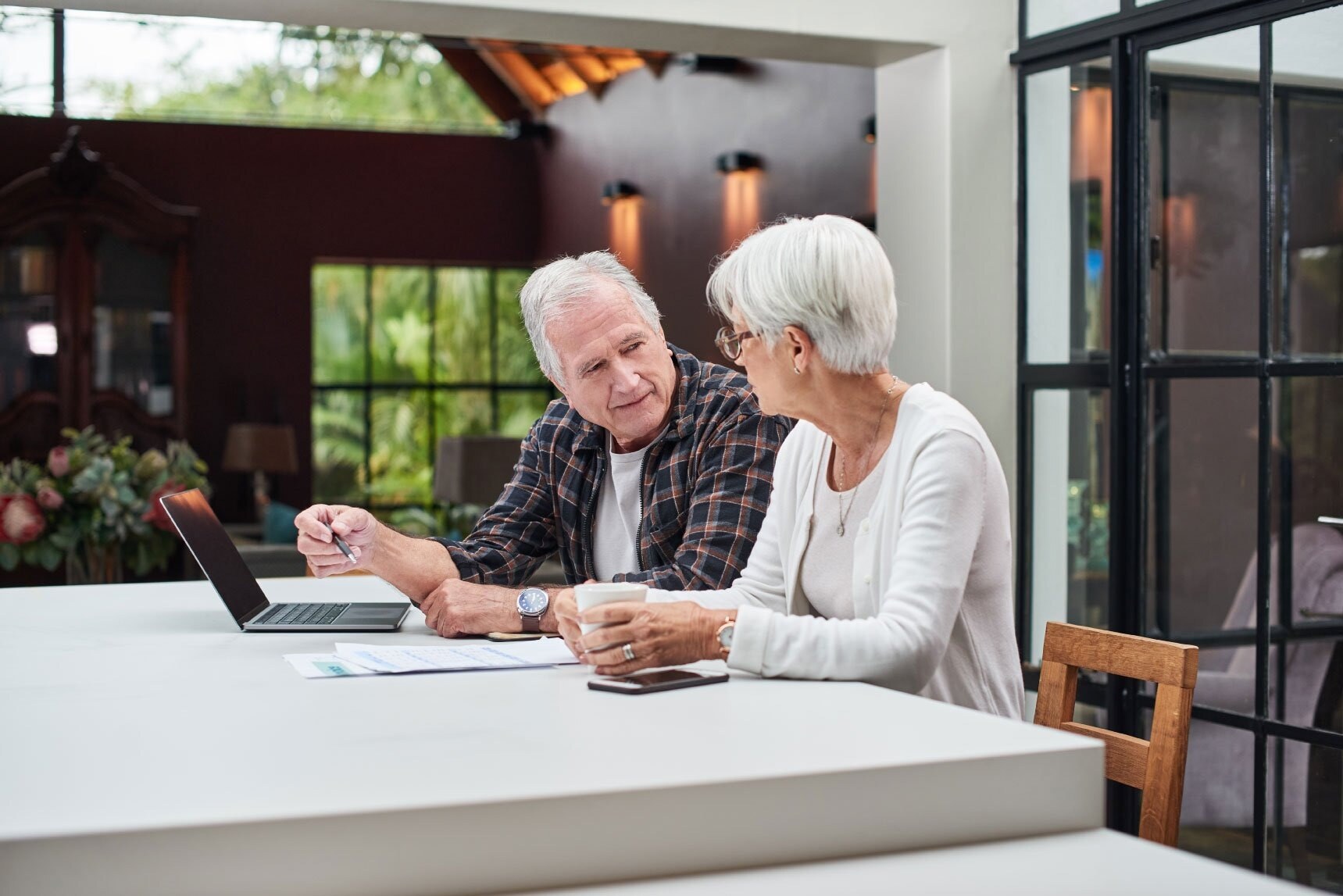 older-couple-sitting-at-home-inf